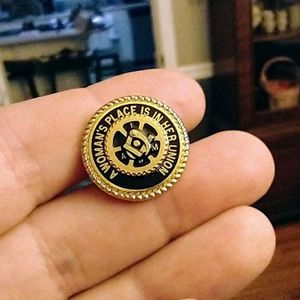 Vintage "A WOMAN'S PLACE IS IN HER UNION" pin